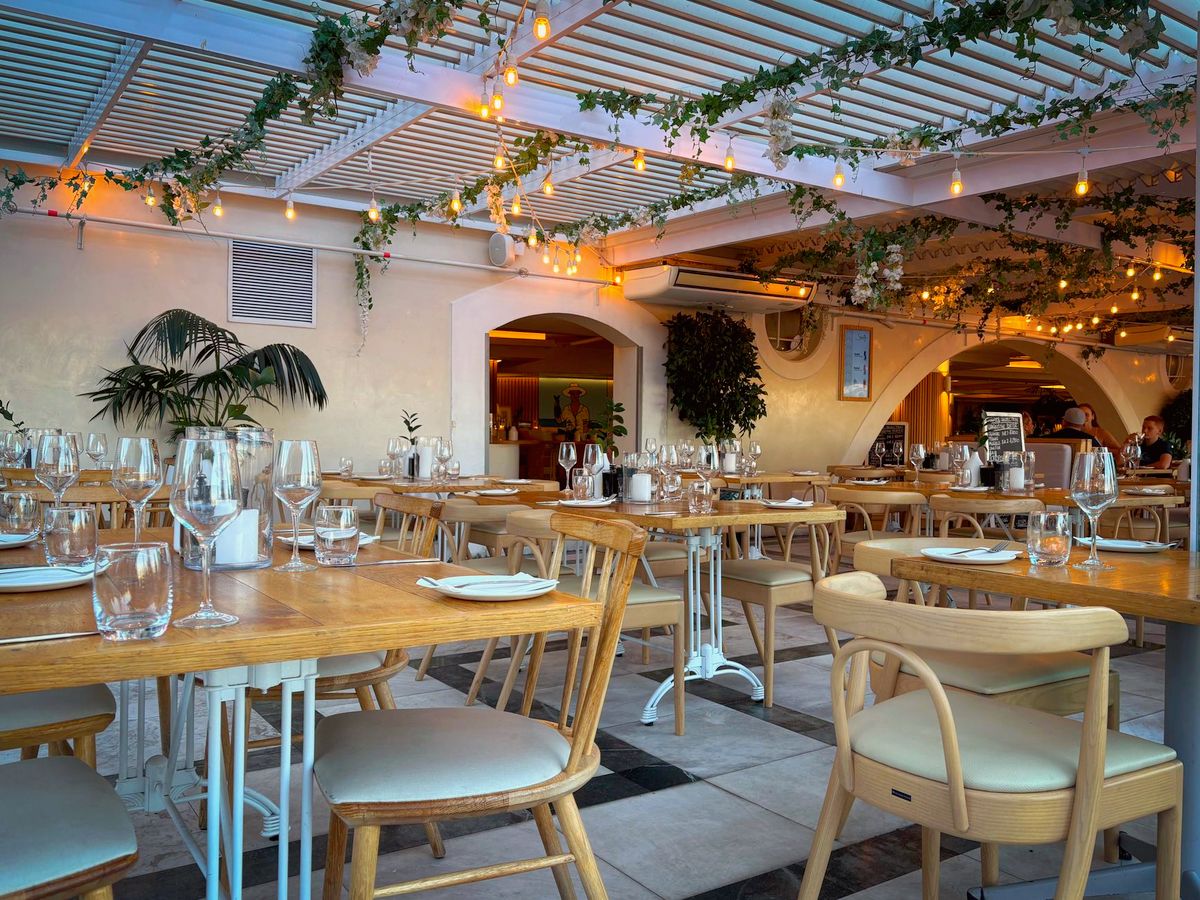 Bright restaurant dining room set for service